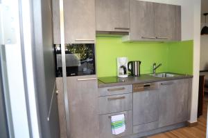 a kitchen with a sink and a counter top at Appartement Ilvy in Söll