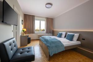 Postel nebo postele na pokoji v ubytování campus Horn