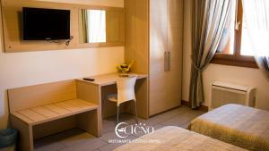 Postel nebo postele na pokoji v ubytování Hotel Ristorante Cigno - Camere and Aparthotel