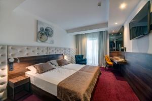 سرير أو أسرّة في غرفة في Hotel Scala d'Oro