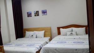 Postel nebo postele na pokoji v ubytování Starhill Hotel