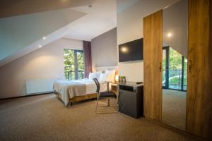 Voodi või voodid majutusasutuse AuRoom Bakuriani Resort toas