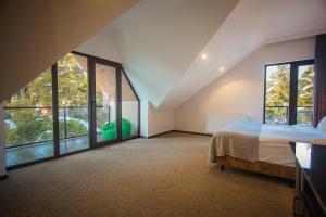 Voodi või voodid majutusasutuse AuRoom Bakuriani Resort toas