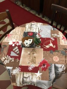 a table with christmas items on top of it at B&B Galileo Galilei in Caserta