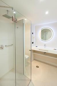 a bathroom with a glass shower and a toilet at Benidorm Centre - Adults Only in Benidorm