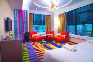 Postel nebo postele na pokoji v ubytování Green World Hotel - Zhonghua