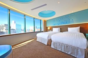 Postel nebo postele na pokoji v ubytování Green World Hotel - Zhonghua