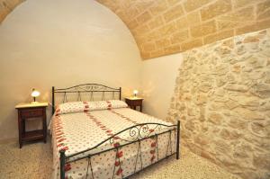 Postel nebo postele na pokoji v ubytování Trullo Dei Beneficati by Salento Affitti
