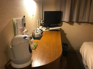 TV a/nebo společenská místnost v ubytování Business Hotel Goi Hills