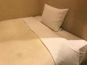 Postel nebo postele na pokoji v ubytování Business Hotel Goi Hills