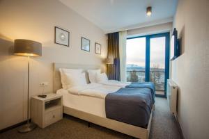Voodi või voodid majutusasutuse AuRoom Bakuriani Resort toas