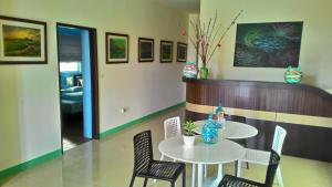 a dining room with a table and chairs and a room at Dreamily Fish B&B in Magong