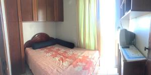 Cama ou camas em um quarto em Kitnet em Ponta da Fruta
