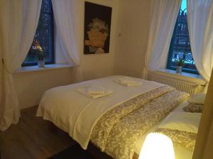Łóżko lub łóżka w pokoju w obiekcie Apartmány Ruprechtov