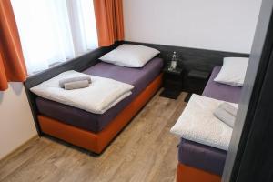Postel nebo postele na pokoji v ubytování Apartments A7