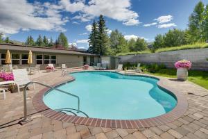 a swimming pool in a patio with chairs and a house at Sun Valley Serenity in Sun Valley