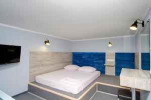 Кровать или кровати в номере Grand Apartments