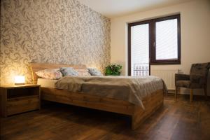 Postel nebo postele na pokoji v ubytování Apartmán Skalnička - Tatranská Lomnica