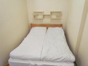 Ένα ή περισσότερα κρεβάτια σε δωμάτιο στο Arsego Hostel