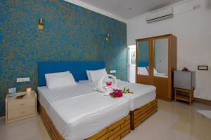 Postel nebo postele na pokoji v ubytování Dream Inn Sun Beach Hotel Maldives
