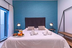 Posteľ alebo postele v izbe v ubytovaní Málaga Central Suites