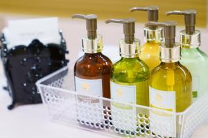 three bottles of wine in a basket on a counter at Hiroshima no Oyado in Hiroshima