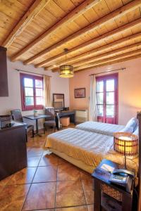 A bed or beds in a room at Lively Lofts by The Varos Residences