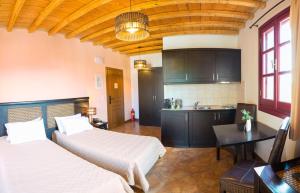 A bed or beds in a room at Lively Lofts by The Varos Residences