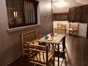 a dining room with a table and chairs at La Plume in Ban Phe