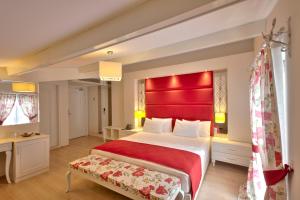 Posteľ alebo postele v izbe v ubytovaní Baga Hotel