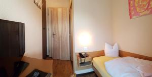 Postel nebo postele na pokoji v ubytování Hotel Europa Guest House
