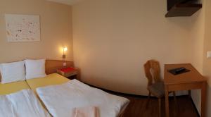 Postel nebo postele na pokoji v ubytování Hotel Europa Guest House
