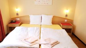 Postel nebo postele na pokoji v ubytování Hotel Europa Guest House