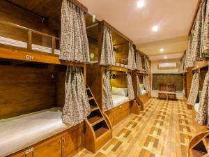 a room with four bunk beds in it at Hygeinic Airport Dormitory Near by BOM in Mumbai