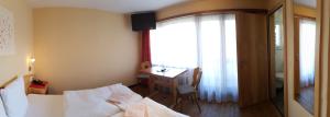 Postel nebo postele na pokoji v ubytování Hotel Europa Guest House