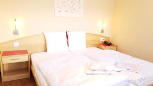 Postel nebo postele na pokoji v ubytování Hotel Europa Guest House