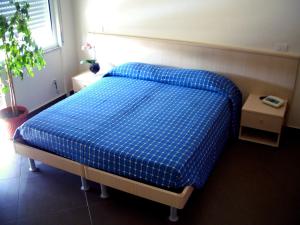 Postel nebo postele na pokoji v ubytování Albergo Riviera Spineta