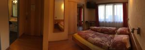 Postel nebo postele na pokoji v ubytování Hotel Europa Guest House