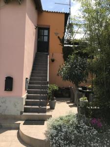 a house with a staircase leading to a door at Apartma Marisol in Izola