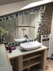a bathroom with a sink and a mirror at Apartma Marisol in Izola
