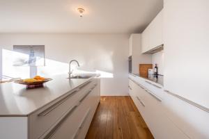 Kuchyň nebo kuchyňský kout v ubytování LAAX Homes - Casa Foppa + 5 fotografií