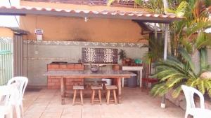 a patio with a table and chairs on a patio at Hotel Cristo Rei 611 in São João del Rei