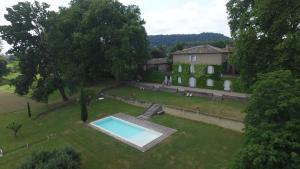 an aerial view of a house with a swimming pool at Domaine de Lamartine in Pont-Saint-Esprit