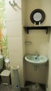 a bathroom with a sink and a toilet at Inn Bless Aparthotel in San Andrés