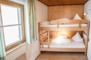 Posteľ alebo postele v izbe v ubytovaní Chalet Appartement Alpenherz