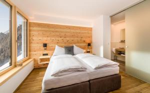 A bed or beds in a room at Bildegg Appartements