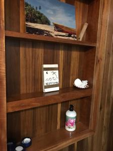 a book sitting on a shelf in a room at Sueño Grande B&B in Puerto Viejo