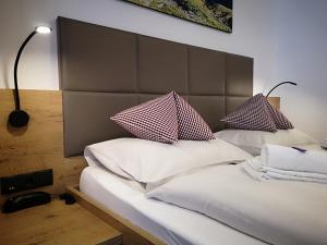 Postel nebo postele na pokoji v ubytování Hotel Aschauer Hof z'Fritzn