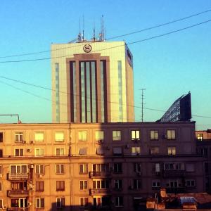 a building with a clock tower on top of it at RomPromo Plus Accommodation in Bucharest