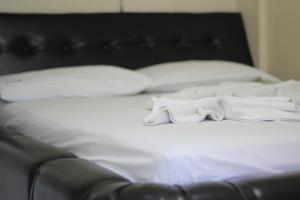 Postel nebo postele na pokoji v ubytování Hotel Pirâmide Rodoviária
